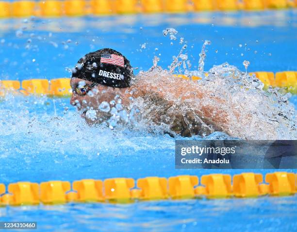 Caeleb Dressel of US competes in the the men's 100m butterfly semifinal of swimming during the Tokyo 2020 Olympic Games at Tokyo Aquatics Centre in...