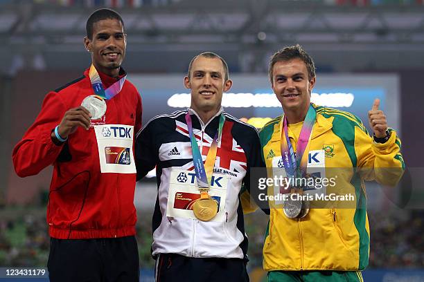 David Greene of Great Britain poses with his gold medal, Javier Culson of Puerto Rico the silver and L.J. Van Zyl of South Africa the bronze, during...