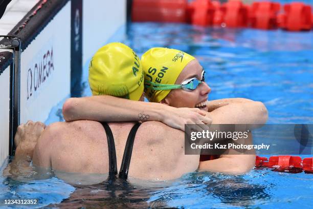 Emma Mckeon of Australia celebrates Gold Medal of Women's 100m Freestyle with her team mate, Cate Campbell of Australia, who gets Bronze Medal on day...