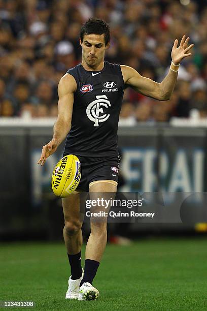 Kane Lucas of the Blues kicks during the round 24 AFL match between the Carlton Blues and the St Kilda Saints at the Melbourne Cricket Ground on...