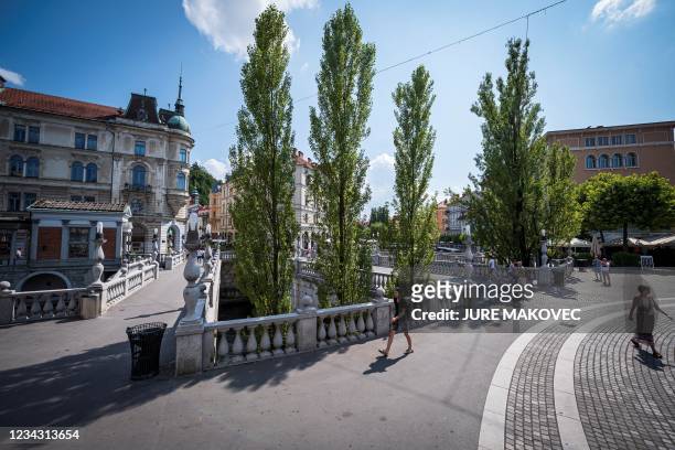 Picture taken on July 29, 2021 shows a view of the Triple Bridge, designed by Slovenian architect Joze Plecnik, in Ljubljana, Slovenia. - The World...