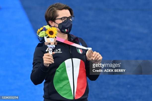 Bronze medallist Italy's Lucilla Boari poses during the women's individual victory ceremony during the Tokyo 2020 Olympic Games at Yumenoshima Park...