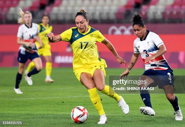 Australia's forward Kyah Simon controls the ball beside Australia's forward Kyra Cooney-Cross during the Tokyo 2020 Olympic Games women's...