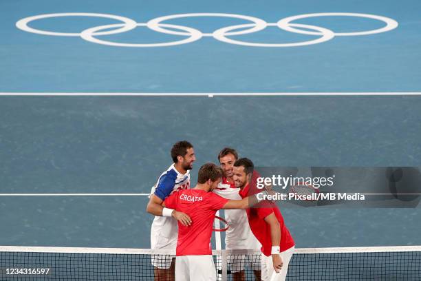 Ivan Dodig of Team Croatia and Marin Cilic of Team Croatia play Mate Pavic of Team Croatia and Nikola Mektic of Team Croatia during their Men's...