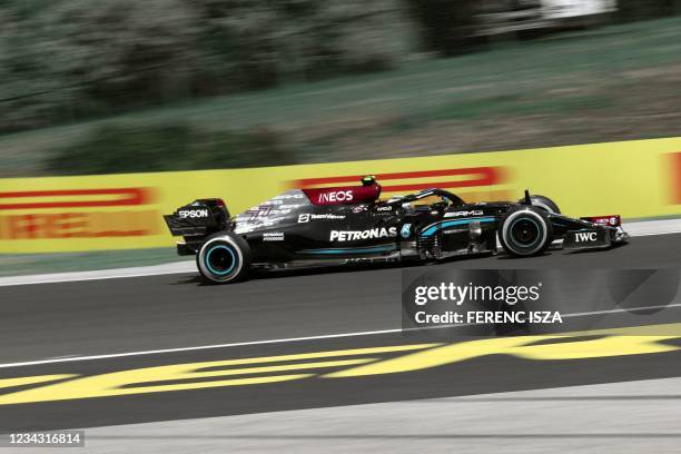 Mercedes' Finnish driver Valtteri Bottas drives during the first practice session at the Hungaroring race track in Mogyorod near Budapest on July 30...