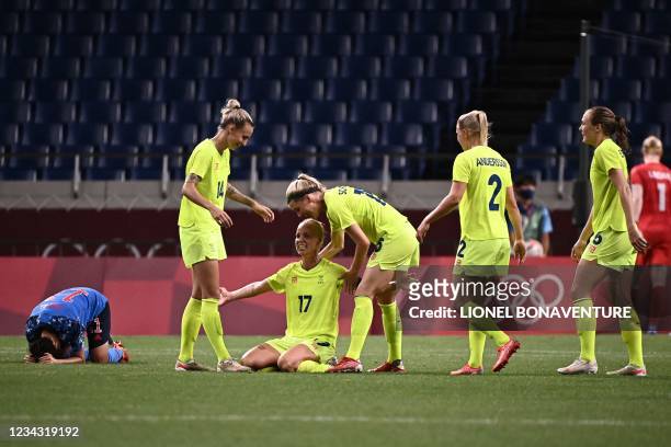 Sweden's players celebrates after winning the Tokyo 2020 Olympic Games women's quarter-final football match between Sweden and Japan at Saitama...