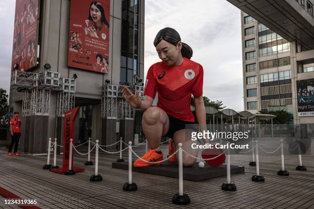 Giant statue of Japanese Olympic table-tennis player Kasumi Ishikawa is displayed outside the Fuji TV headquarters on July 30, 2021 in Tokyo, Japan....