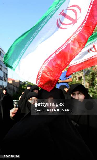 Iranian female demonstrators attend a rally in front of the British Embassy in Tehran on May 22 to protest a British Court of Appeal verdict...