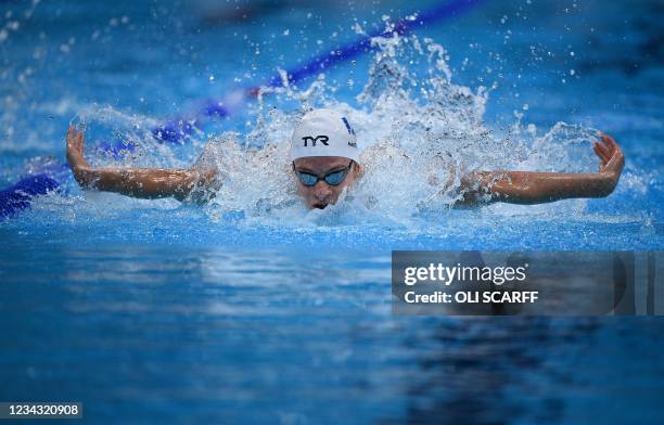 France's Leon Marchand competes in a heat for the men's 4x100m medley relay swimming event during the Tokyo 2020 Olympic Games at the Tokyo Aquatics...