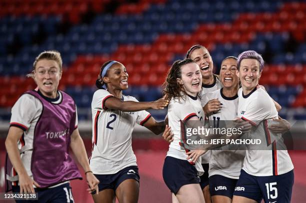 S forward Megan Rapinoe and teammates celebrate after winning the Tokyo 2020 Olympic Games women's quarter-final football match between Netherlands...
