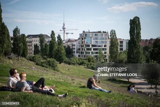 People enjoy the sunny weather in Mauerpark in Berlin on July 30 during the ongoing coronavirus / COVID-19 pandemic.