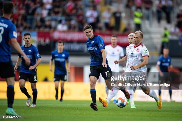 Maximilian Thalhammer of SC Paderborn 07 competes for the ball with Johannes Geis of 1. FC Nürnberg during the Second Bundesliga match between SC...