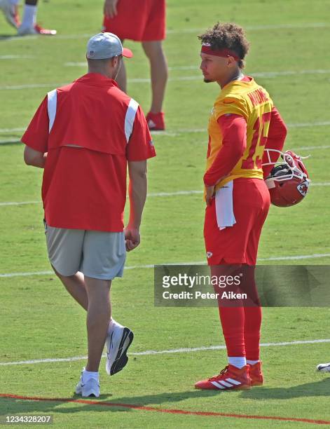 Quarterback Patrick Mahomes of the Kansas City Chiefs talks with quarterback coach Mike Kafka during training camp at Missouri Western State...