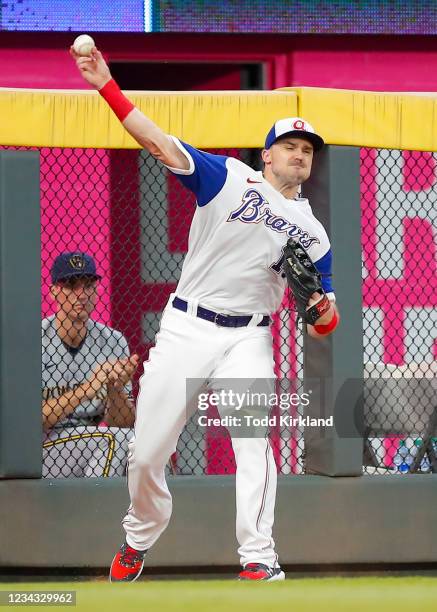 Adam Duvall of the Atlanta Braves throws a ball back to the infield the third inning of an MLB game against the Milwaukee Brewers at Truist Park on...