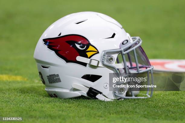 An Arizona Cardinals helmet on the grass during Arizona Cardinals training camp on July 30, 2021 at State Farm Stadium in Glendale, Arizona