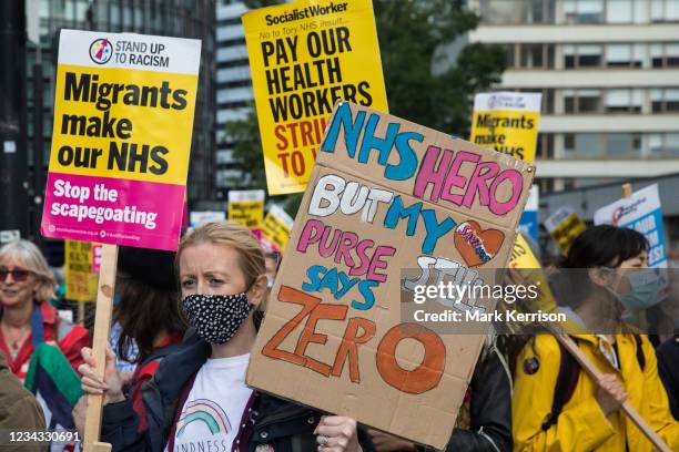 Staff prepare to march from St Thomas' Hospital to Downing Street to protest against the NHS Pay Review Body's recommendation of a 3% pay rise for...