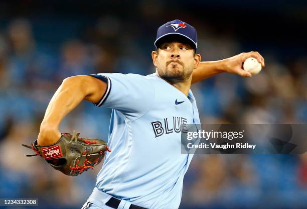 Brad Hand of the Toronto Blue Jays delivers a pitch on his debut for the Blue Jays in the eighth inning during a MLB game against the Kansas City...