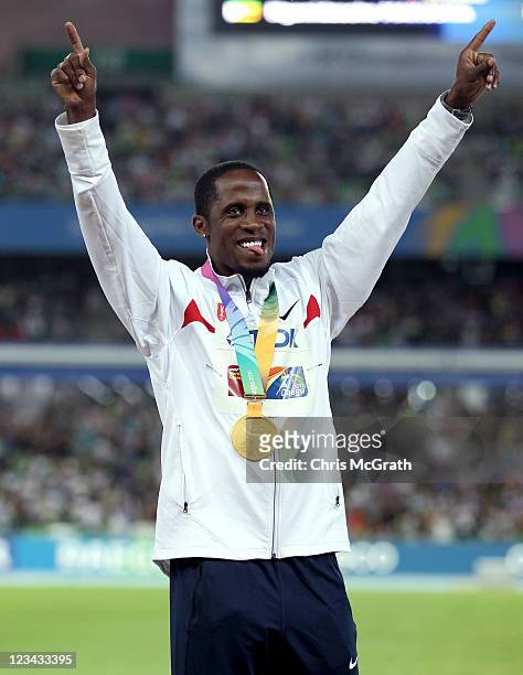 Dwight Phillips of the USA celebrates with his gold medal during the medal ceremony for the men's long jump during day eight of 13th IAAF World...