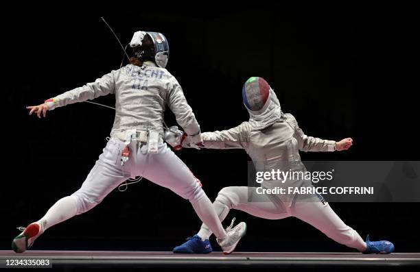 Italy's Irene Vecchi compete against France's Cecilia Berder in the womens team sabre semi-final bout during the Tokyo 2020 Olympic Games at the...