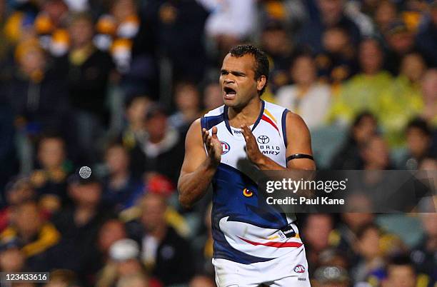 Graham Johncock off the Crows celebrates a goal during the round 24 AFL match between the West Coast Eagles and the Adelaide Crows at Patersons...