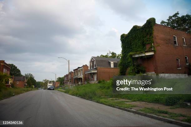Abandoned homes line a street in the Wells-Goodfellow neighborhood in north St. Louis on July 21, 2021.