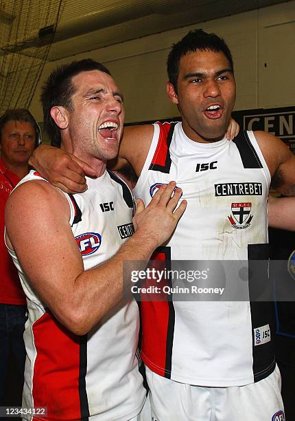 Stephen Milne and Raphael Clarke of the Saints sing the song in the rooms after winning the round 24 AFL match between the Carlton Blues and the St...