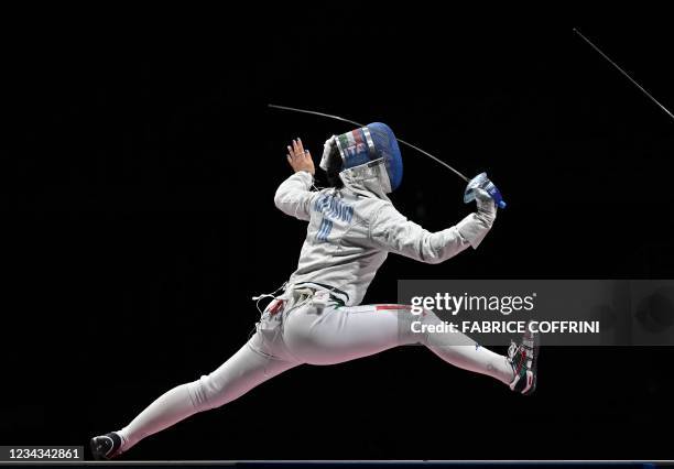 Italy's Michela Battistoni compete against South Korea's Kim Jiyeon in the womens team sabre bronze medal bout during the Tokyo 2020 Olympic Games at...