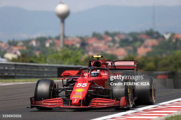 Ferrari's Spanish driver Carlos Sainz Jr drives during the third practice session at the Hungaroring race track in Mogyorod near Budapest, on July 31...