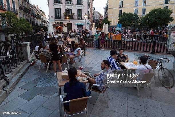 Groups of people enjoy a drink at the Balcon de Malasana terrace during the fifth day of phase one on May 29, 2020 in Madrid, Spain. All regions of...