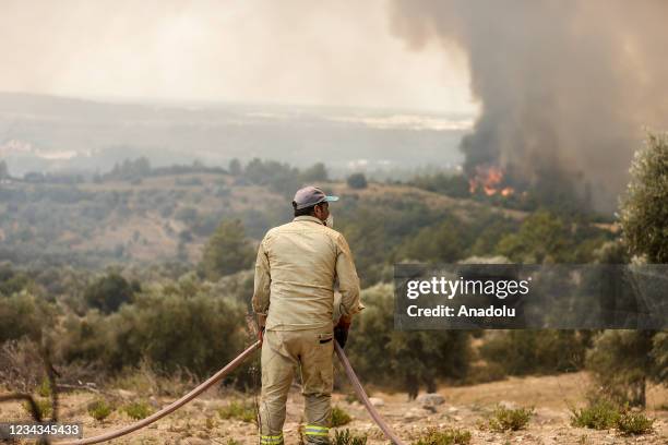 Forestry workers and firefighter teams continue to respond to the forest fire that broke out in Manavgat district of Turkeyâs Antalya on July 31,...