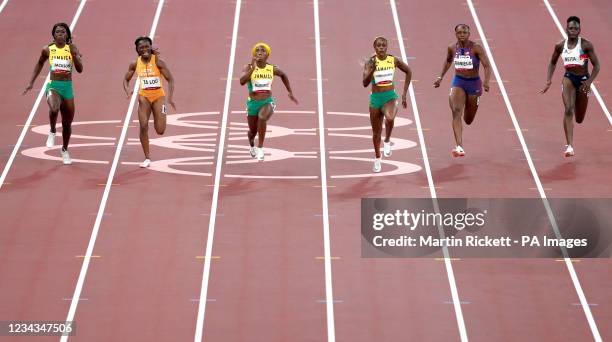 Jamaica's Elaine Thompson-Herah goes on to win the Women's 100 metres final at Olympic Stadium on the eighth day of the Tokyo 2020 Olympic Games in...