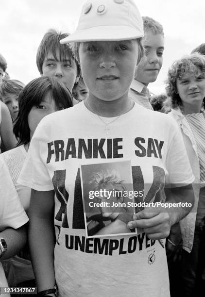 Fan in the audience watching British musician Howard Jones performing during the Radio One Roadshow at The Hoe in Plymouth, England on 30th August,...