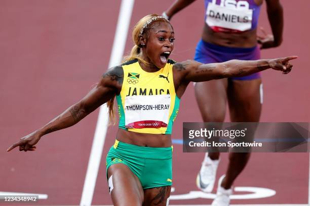 Elaine Thompson-Herah of Team Jamaica celebrates across the line after winning the Women's 100m Final on Day 8 of the Tokyo 2020 Olympic Games at...
