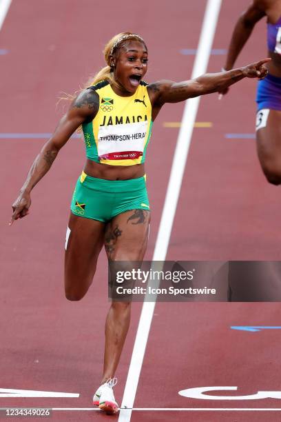 Elaine Thompson-Herah of Team Jamaica celebrates across the line after winning the Women's 100m Final on Day 8 of the Tokyo 2020 Olympic Games at...