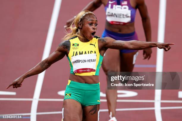 Elaine Thompson-Herah of Team Jamaica celebrates across the line after winning the Women's 100m Final on Day 8 of the Tokyo 2020 Olympic Games at...