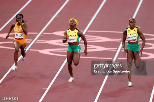 Elaine Thompson-Herah of Team Jamaica and Shelly-Ann Fraser-Pryce of Team Jamaica side by side during the Women's 100m Final on Day 8 of the Tokyo...