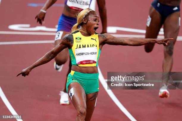 Elaine Thompson-Herah of Team Jamaica celebrates across the line after winning the Women's 100m Final on Day 8 of the Tokyo 2020 Olympic Games at...