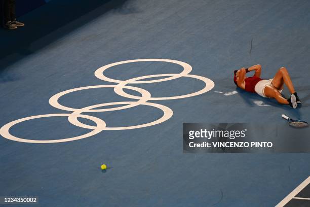 Switzerland's Belinda Bencic celebrates after defeating Czech Republic's Marketa Vondrousova during their Tokyo 2020 Olympic Games women's singles...