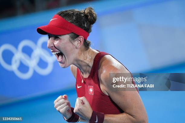 Switzerland's Belinda Bencic celebrates after defeating Czech Republic's Marketa Vondrousova during their Tokyo 2020 Olympic Games women's singles...