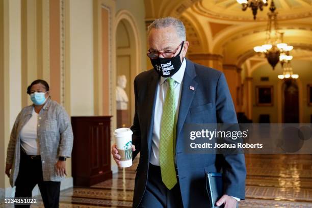 Senate Majority Leader Chuck Schumer arrives at his office before opening the Senate for debate on a $1 trillion infrastructure bill on July 31, 2021...