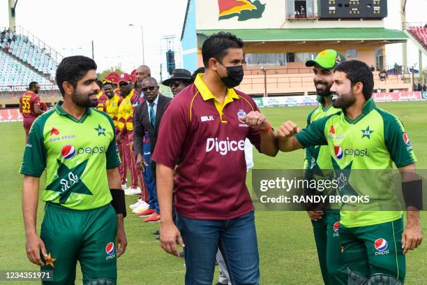 Babar Azam introduces Mohammad Rizwan and Shadab Khan of Pakistan to Charles Ramson Minister of Sports at the start of the 2nd T20I match between the...