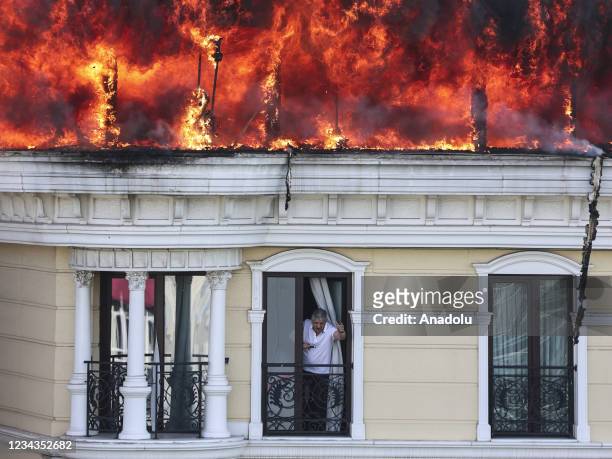 Smokes and flames rise after a fire breaks out on the roof of a hotel in Maltepe district of Turkish capital Ankara on July 31, 2021.