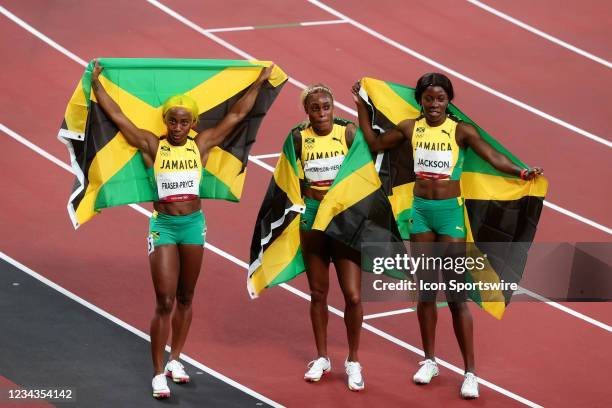 Team Jamaica's runner-up Shelly-Ann Fraser-Pryce, first-place finisher Elaine Thompson Herah and third-place finisher Shericka Jam Jackson celebrate...