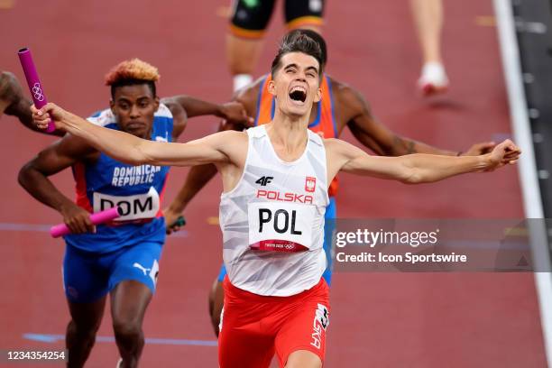 Kajetan Duszynski of team Poland crosses the finish line and wins the Mixed 4 x 400m Relay Final on Day 8 of the Tokyo 2020 Olympic Games at Olympic...