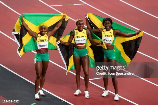 Team Jamaica's runner-up Shelly-Ann Fraser-Pryce, first-place finisher Elaine Thompson Herah and third-place finisher Shericka Jam Jackson celebrate...