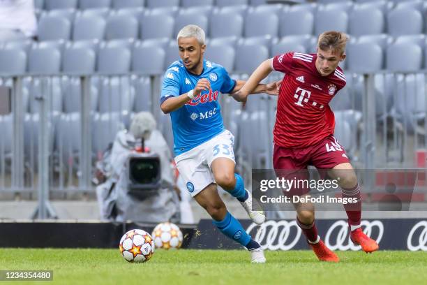 Adam Ounas of SSC Neapel and Torben Rhein of Bayern Muenchen battle for the ball during the Pre-Season Match between FC Bayern Muenchen and SSC...