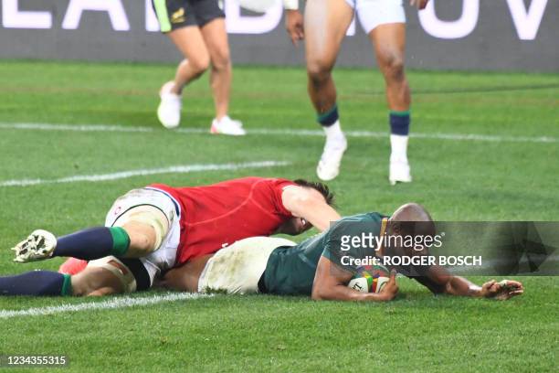 South Africa's wing Makazole Mapimpi scores a try during the second rugby union Test match between South Africa and the British and Irish Lions at...
