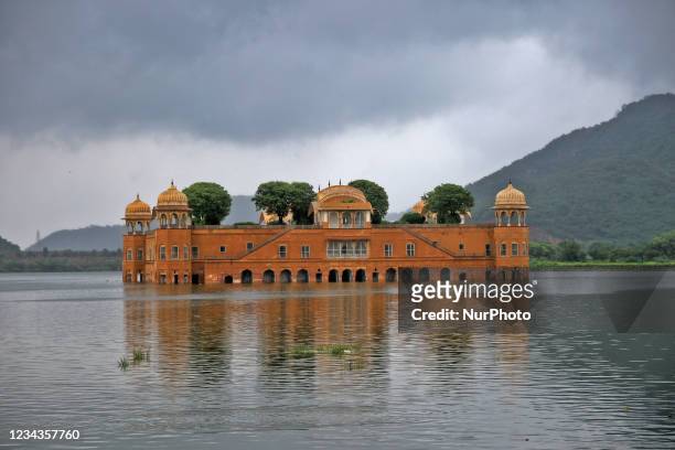 View of historical ' Jal Mahal' as clouds hover over it on a rainy day during the monsoon season in Jaipur, Rajasthan, India, Saturday, July 31, 2021.