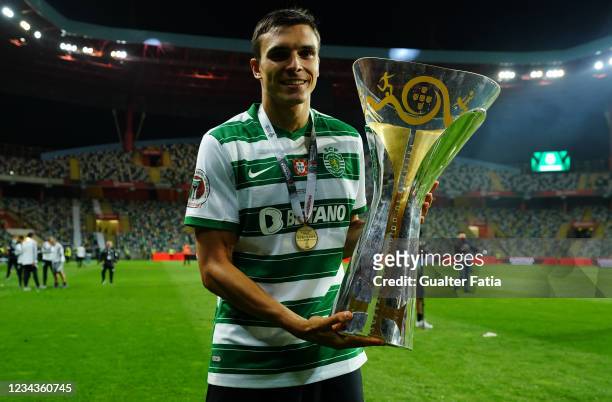 Joao Palhinha of Sporting CP of Sporting CP celebrates winning the Portuguese SuperCup with trophy at the end of the Portuguese SuperCup match...