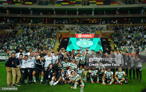 Sporting CP players pose for a team photo with trophy after winning the Portuguese SuperCup at the end of the Portuguese SuperCup match between...